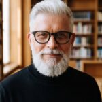 black turtleneck, bookshelf